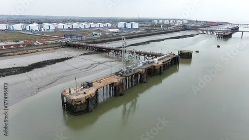 Photography Aerial drone view of gas terminals and storage silos fuel docks for loading and
