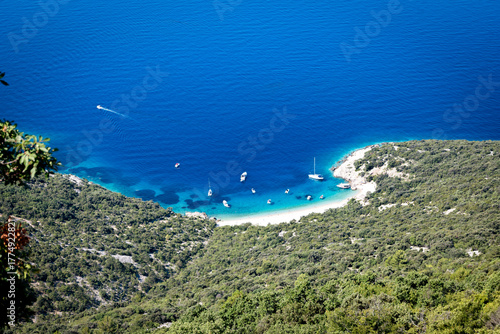 Fototapeta Naklejka Na Ścianę i Meble -  Amazing Lubenice beach, almost only accessible by the sea, with its turquoise waters and sand shore, below steep slopes of Cres island, Croatia