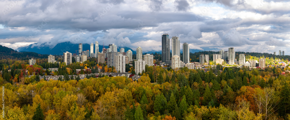 Fototapeta premium Autumn City Skyline Over Burnaby Forests and Mountains in Vancouver Metro, British Columbia, Canada