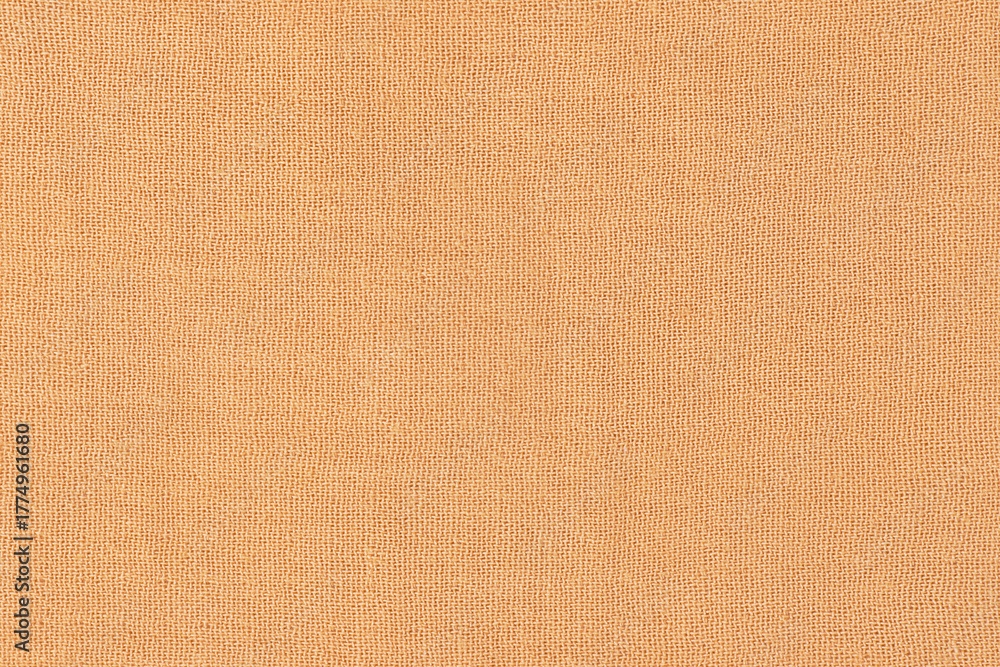 Fototapeta premium Beige fabric texture macro photo as background.