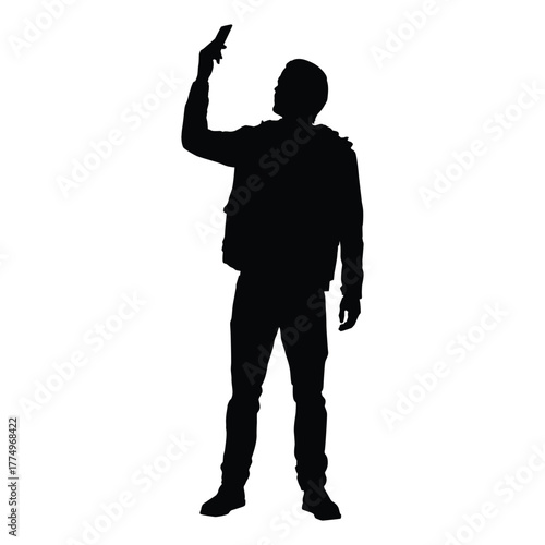 Silhouette of Man Taking a Selfie or Searching for Mobile Signal with Phone Held Up