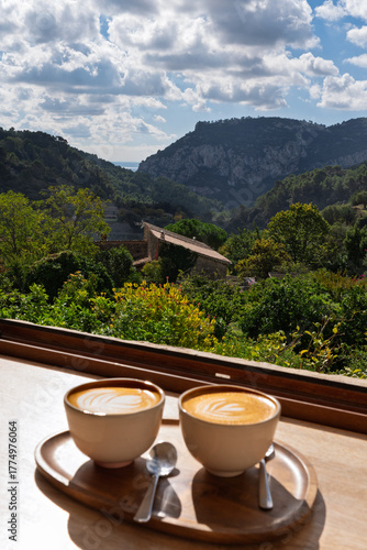 Coffee shop window view in Binissalem over the mountains