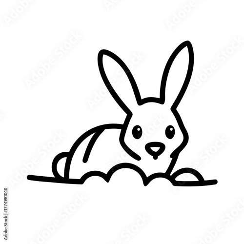 Cute rabbit resting on the grass