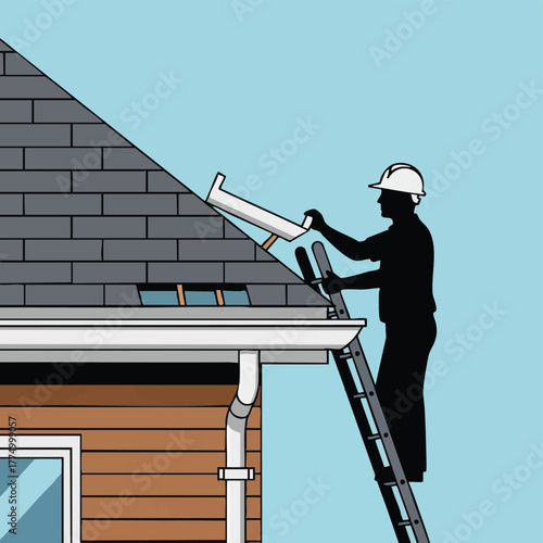 A silhouette of a construction worker on a ladder, installing a gutter on a house roof with a clear blue sky background.