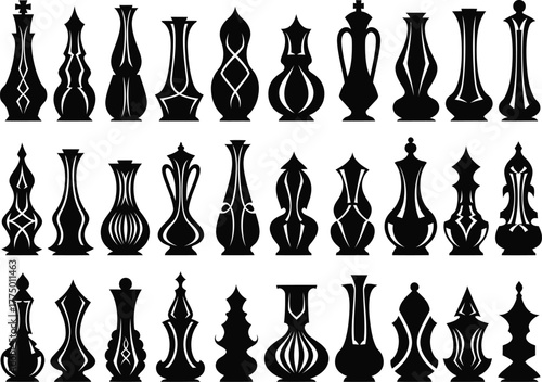 Collection of elegant black silhouette chess pieces on a white background displayed in rows