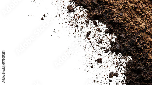 Close-up shot showing a pile of dark brown earth against a solid black background