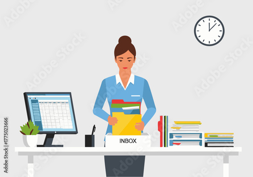 A businesswoman organizing files and documents at her office desk, managing her inbox.