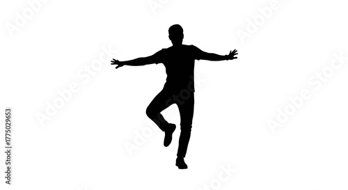 Silhouette of a dynamic male dancer striking a poised pose against white backdrop creating contrast