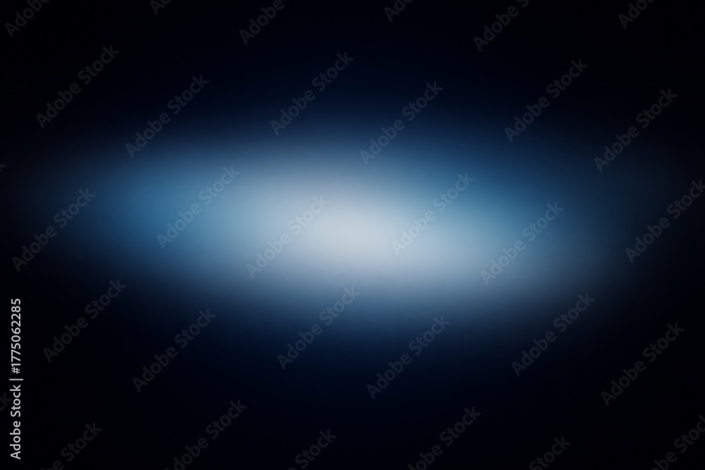 Obraz premium Abstract blurred background with a soft light in the center, surrounded by dark blue and black.