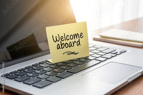 A Welcome Aboard Message on a Laptop Keyboard