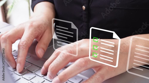 Detail of female hands typing on a laptop computer with the animation of several documents, one of them has a checklist