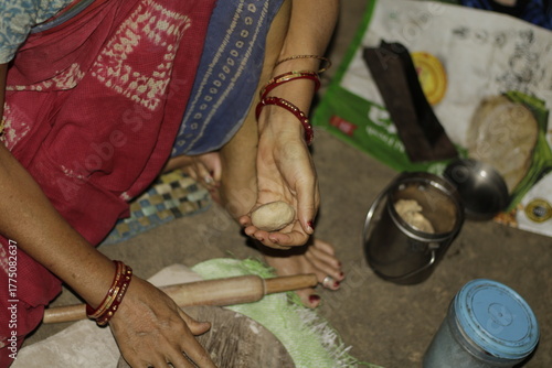 Traditional Indian cooking scene showing a woman shaping chapati dough, representing love, care, and the everyday rhythm of rural and urban Indian life.