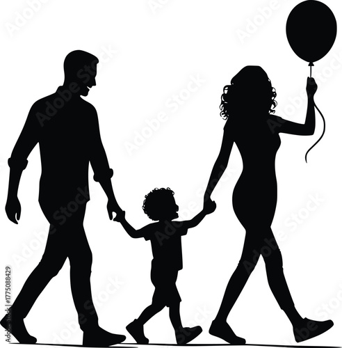 Silhouetted family with child and balloon walking together holding hands