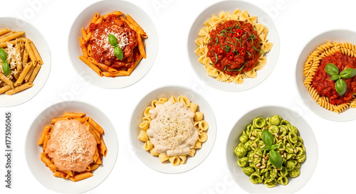 Overhead shot of seven different pasta dishes in white bowls, isolated on white background.