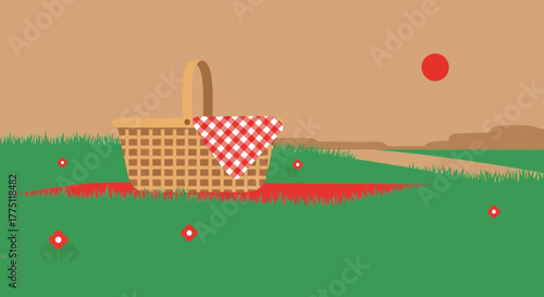 A picnic basket with a red and white checkered cloth sits on green grass with scattered red dots.