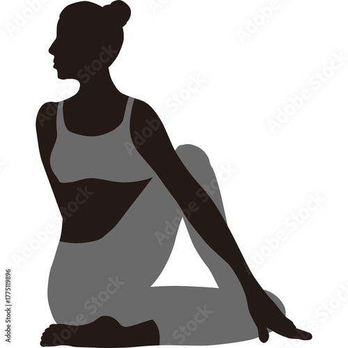 Silhouette of a woman performing a yoga pose in a studio with a plain background wearing grey athletic wear