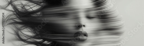 Abstract portrait of a woman in motion blur, symbolizing emotion, mystery, and movement. Monochrome fine art photography blending surreal beauty and dynamic energy with soft light and texture.