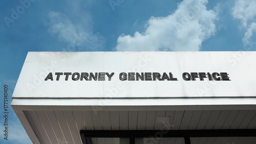 Attorney General Office word sign displayed on the exterior of an official government building under a clear blue sky, symbolizing law enforcement, legal authority, governance, and public service