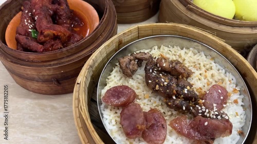 a variety of Chinese dim sum dishes, including siu mai, custard buns, sticky rice, and tofu rolls, all served in traditional bamboo steamers.