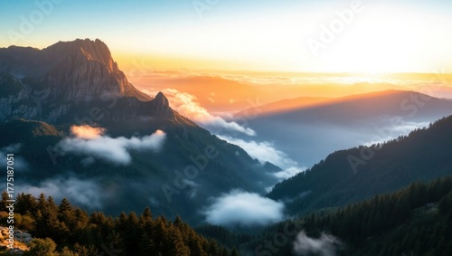 Golden sunrise over misty mountain valley landscape