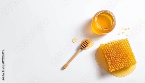 Jar of honey with honeycomb and dipper on white background, top view, healthy food