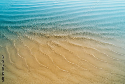 Fototapeta Naklejka Na Ścianę i Meble -  A drone shot capturing the hypnotic symmetry of endless sand ripples