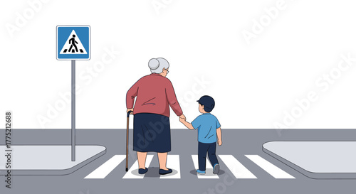 A young boy holds hands with an elderly woman as they cross a street at a pedestrian crossing.