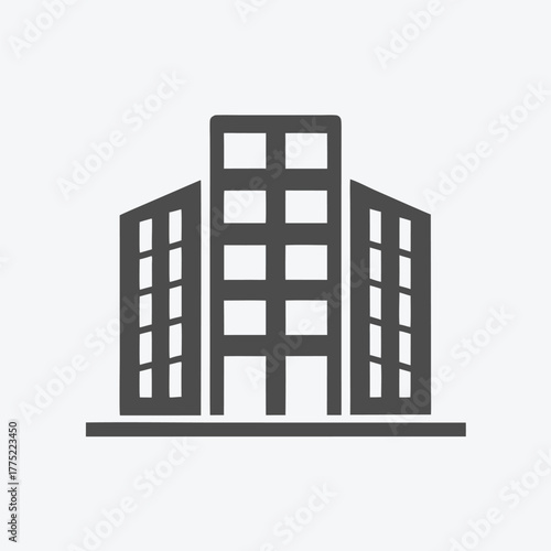 Dark gray office building icon presents a central tower and two side wings
