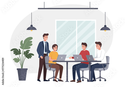 A team of colleagues working on laptops in a modern office with their manager supervising the project.