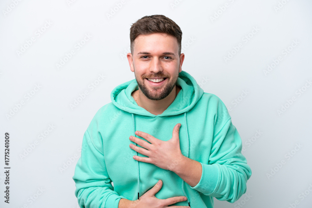 Fototapeta premium Young caucasian man isolated on white background smiling a lot