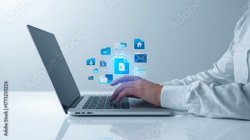 A person interacts with a laptop featuring a futuristic digital interface, displaying floating file folders and documents, highlighting concepts of data management, file sharing, and cloud storage.