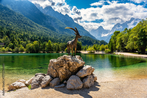 Quadro su tela Beautiful Kozorog Lake with goat statue, wildlife from the Alps, Slovenia