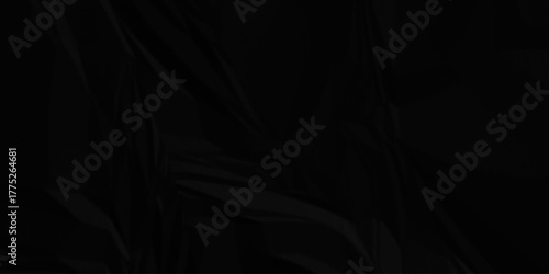 Black crumpled paper creased grunge texture. Paper wrinkled surface glued paper poster background.