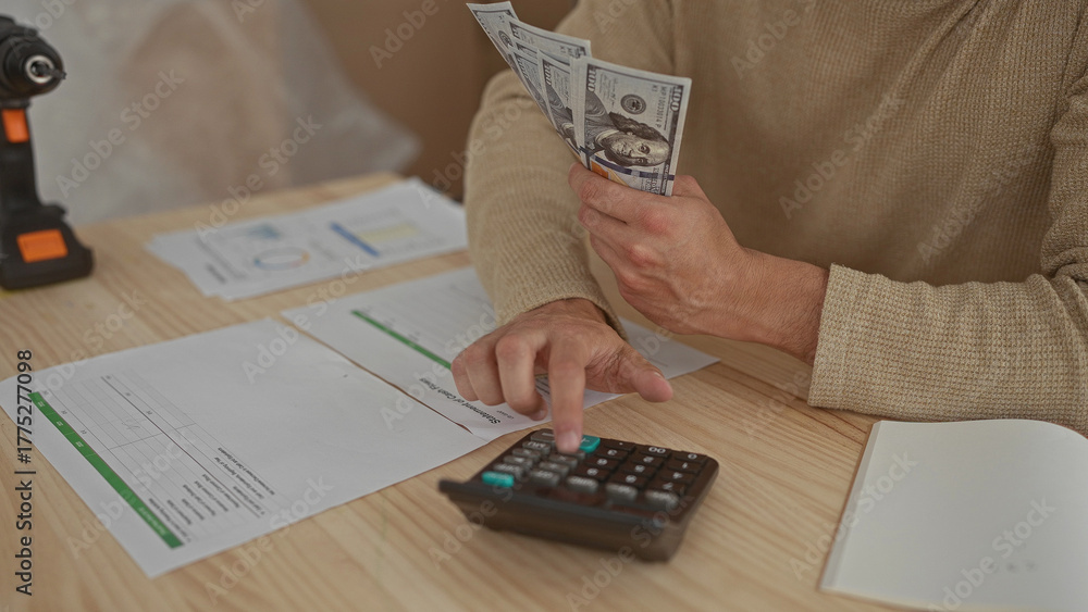 Obraz premium Man hands counting at home desk display young hispanic boxes containing cash near calculator and bills.