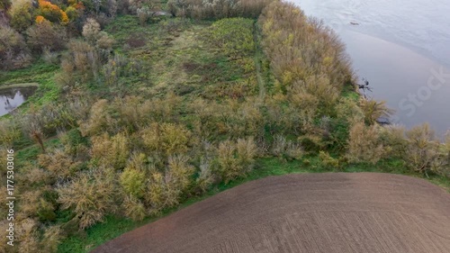 Aerial Vistula River farm land north Poland 2. Forests with rural farm agriculture farm landscape. Historic and economic basis of eastern Europe. Autumn fall colors. Rich agricultural heritage.