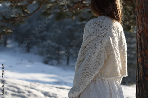 cozy sweater adorned with intricate patterns stands out elegantly against stunning winter landscape