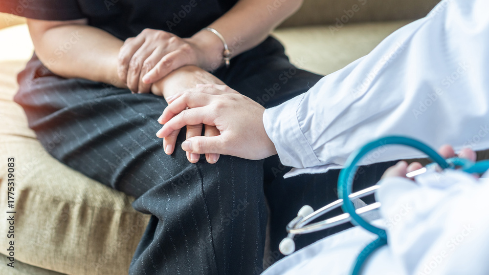 Fototapeta premium Arthritis hand and knee pain, joint injury or Osteoporosis bone disease patient with orthopedic surgical doctor consulting examining middle-age old menopause woman in medical clinic exam room