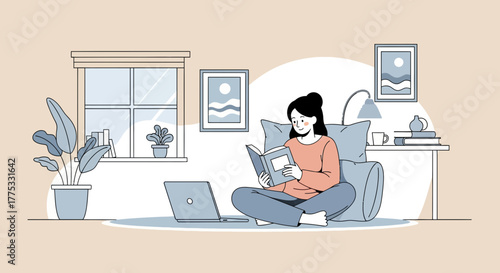 Woman Reading a Book Comfortably Indoors Near the Laptop and Home Related Decor