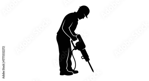 Silhouette of a construction worker using a jackhammer for demolition work on a project.