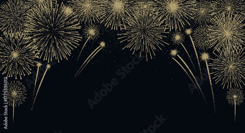 Golden fireworks exploding in the dark night sky creating a festive border with copy space.