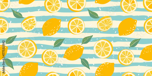 Vibrant yellow lemon slices and whole fruits with green leaves on a blue and white striped background