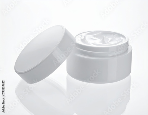 Open jar white cream cosmetic container skincare moisturizer beauty product minimal lid glossy clean aesthetic with calm mood, open jar of white cream cosmetic container for skincare moisturizer
