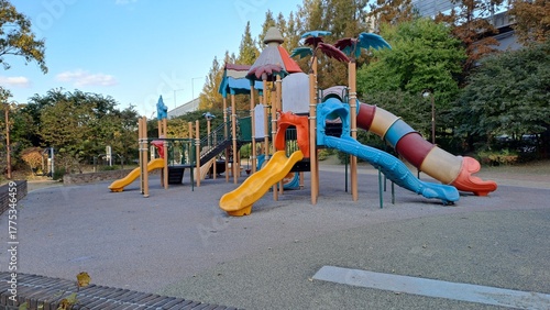 Wallpaper Mural colorful empty playground structure with slides and climbing frames in an urban park on an autumn day Torontodigital.ca