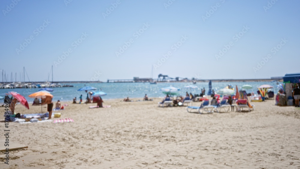 Fototapeta premium Sunlit blurred beach scene with soft bokeh and distant pier in shallow focus outdoor; background copyspace backplate calm.