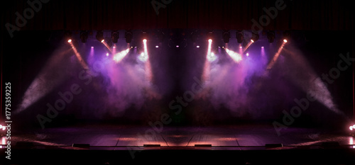 Spotlights in the concert hall. Stage light with colored spotlights and smoke.