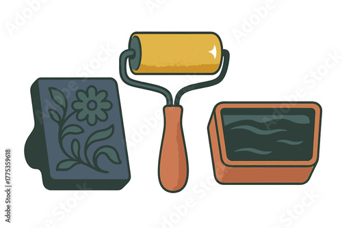Traditional printmaking equipment setup with brayer roller, ink well, and carved floral block