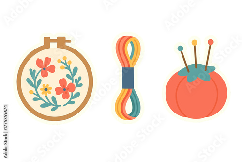 Colorful collection of embroidery and sewing craft supplies with floral hoop, thread, and pincushion
