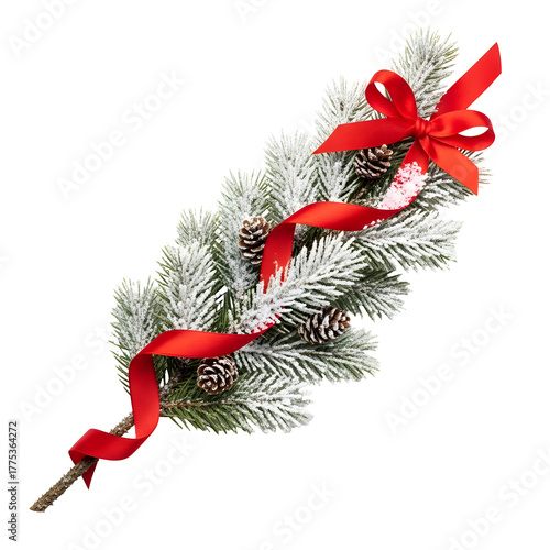 Snowcovered fir branch with pinecones and a festive red ribbon bow.