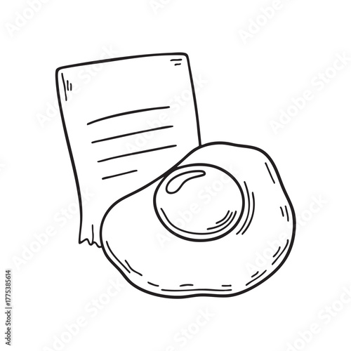 A yolk resting near a recipe card with handwritten notes