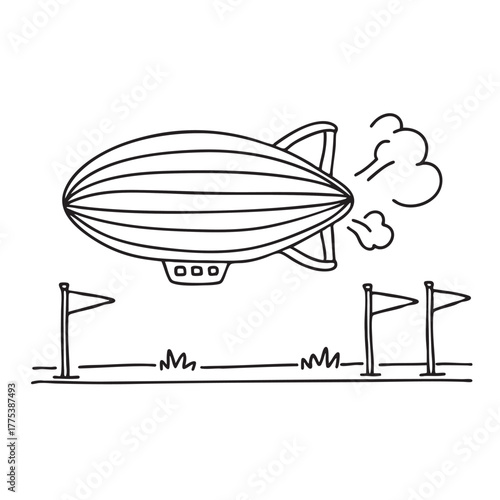 A zeppelin near a field marked with landing flags